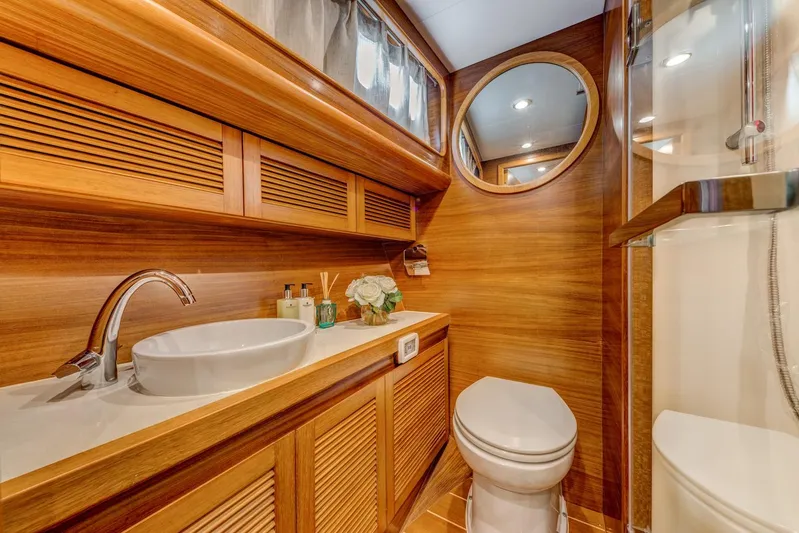  Yacht Photos Pics Luxurious wooden bathroom in 2025 Norseman 45 FreeOcean yacht, featuring modern fixtures.