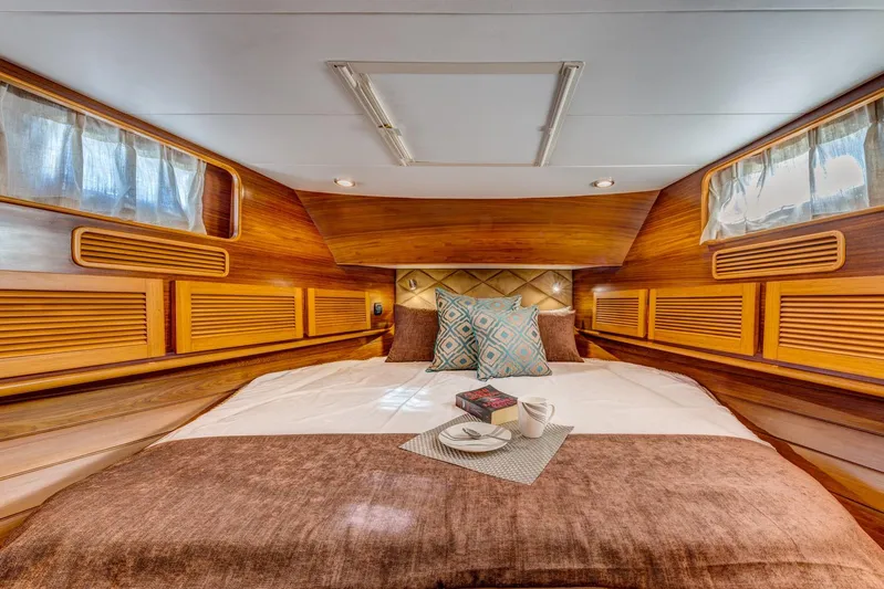  Yacht Photos Pics Luxurious cabin interior of 2025 Norseman 45 FreeOcean yacht with cozy bedding.
