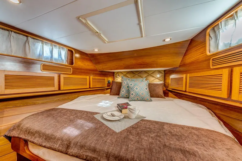  Yacht Photos Pics Luxurious cabin interior of 2025 Norseman 45 FreeOcean yacht with cozy bedding.