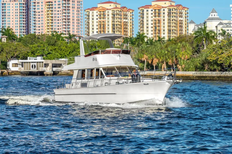  Yacht Photos Pics 2025 Norseman 45 FreeOcean yacht cruising near waterfront cityscape.