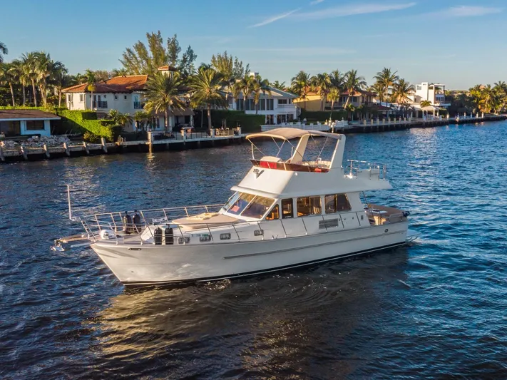  Yacht Photos Pics 2025 Norseman 45 FreeOcean yacht cruising near waterfront homes.