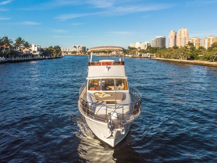  Yacht Photos Pics Norseman 45 FreeOcean 2025 yacht cruising on a scenic waterway with city skyline.