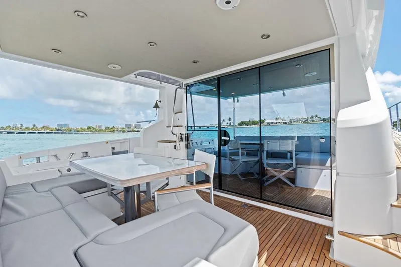 Mi Boat Yacht Photos Pics Luxurious 2019 Azimut yacht deck with seating, table, and ocean view.
