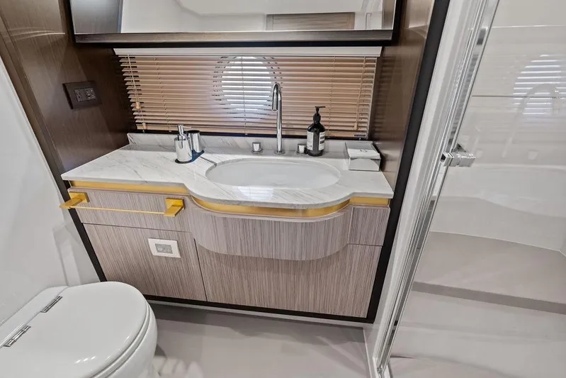 Mi Boat Yacht Photos Pics Luxurious Azimut yacht bathroom with modern sink, marble countertop, and elegant fixtures, 2019 model.