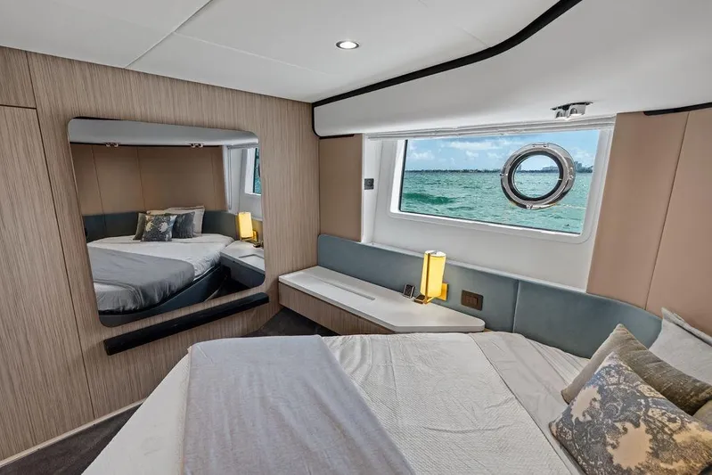 Mi Boat Yacht Photos Pics Luxurious Azimut yacht bedroom interior with ocean view, modern decor, and elegant furnishings, 2019 model.