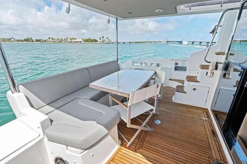 Mi Boat Yacht Photos Pics Luxurious 2019 Azimut yacht deck with seating, table, and ocean view.