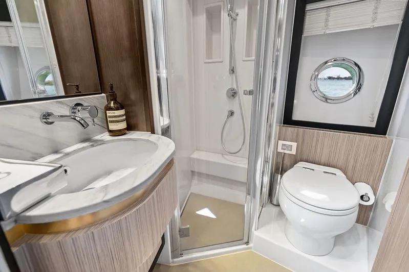 Mi Boat Yacht Photos Pics Luxurious 2019 Azimut yacht bathroom with modern fixtures and porthole window.