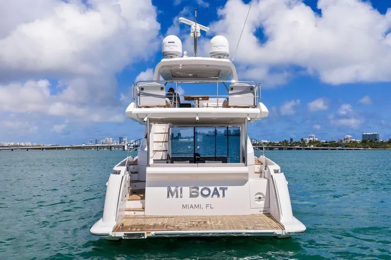Mi Boat Yacht Photos Pics Azimut yacht from 2019 on Miami waters, clear skies, city skyline in background.