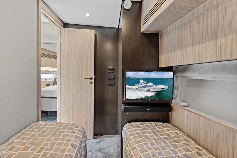 Mi Boat Yacht Photos Pics Interior of 2019 Azimut yacht cabin with twin beds and wall-mounted TV.