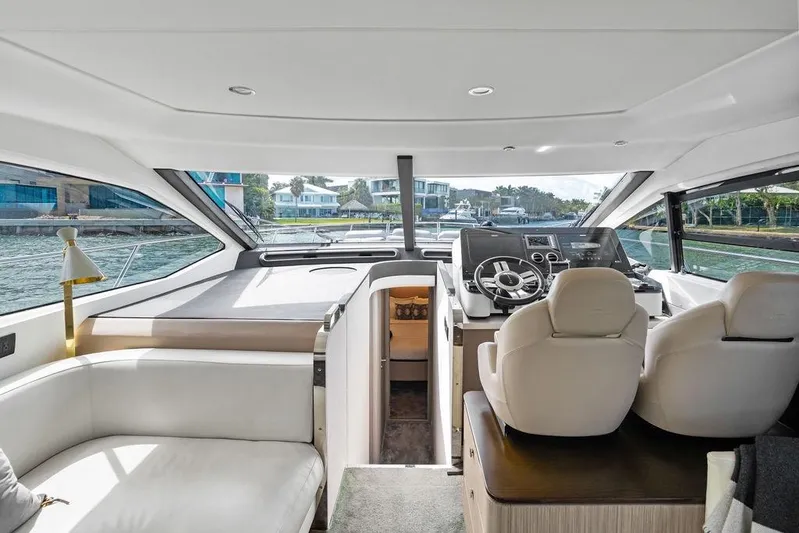 Mi Boat Yacht Photos Pics Interior of a 2019 Azimut yacht with modern helm and luxurious seating.