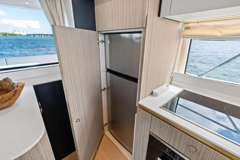 Mi Boat Yacht Photos Pics Modern Azimut yacht kitchen interior with stainless steel fridge and ocean view, 2019 model.