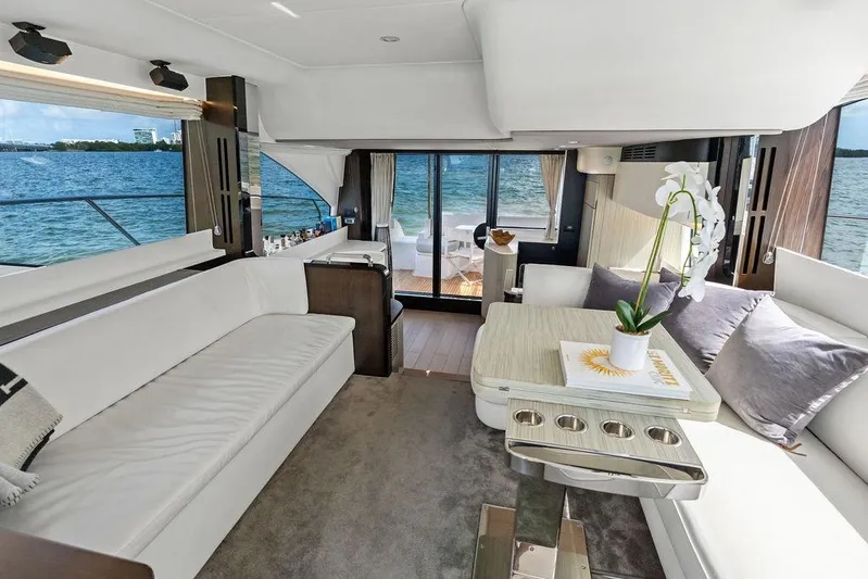 Mi Boat Yacht Photos Pics Luxurious 2019 Azimut yacht interior with elegant seating, table, and ocean view.