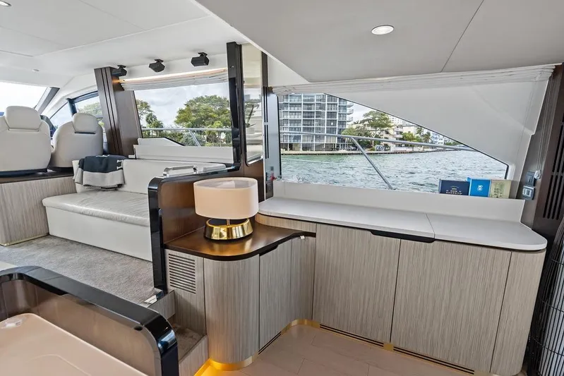 Mi Boat Yacht Photos Pics Luxurious interior of a 2019 Azimut yacht with modern furnishings and waterfront view.