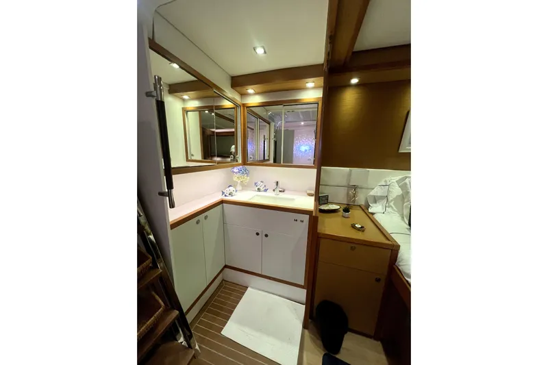 Capricho Yacht Photos Pics Luxurious interior of 2011 Lagoon 560 yacht with modern bathroom and wooden accents.