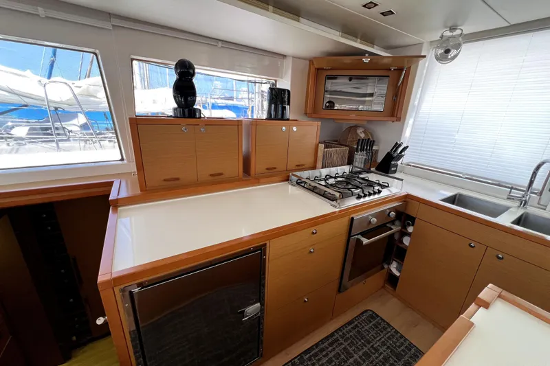Capricho Yacht Photos Pics Modern kitchen interior of 2011 Lagoon 560 yacht with stove, sink, and ample storage.