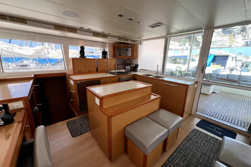 Capricho Yacht Photos Pics Luxurious interior of 2011 Lagoon 560 yacht with modern kitchen and seating area.
