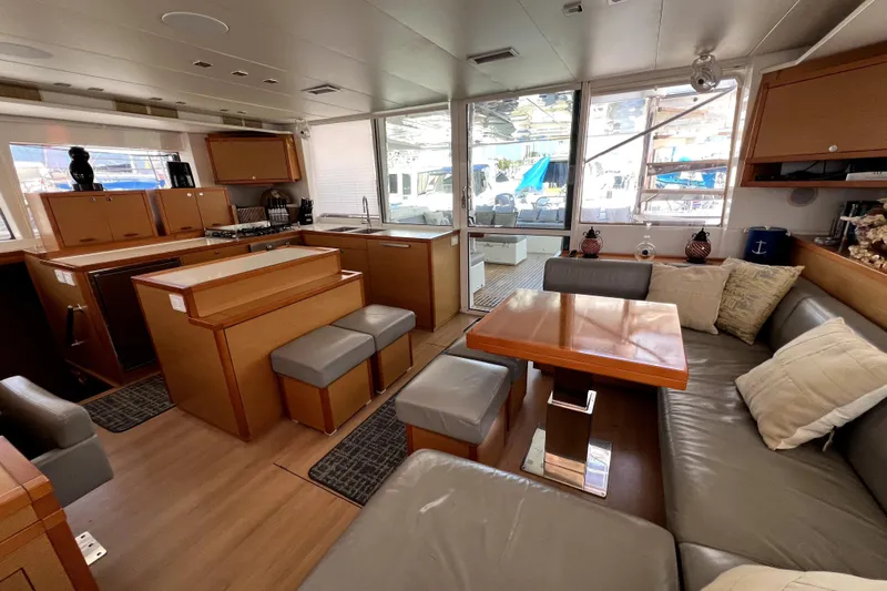 Capricho Yacht Photos Pics Luxurious interior of 2011 Lagoon 560 yacht with modern kitchen and cozy seating area.