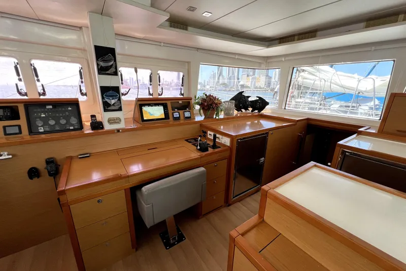 Capricho Yacht Photos Pics Luxurious interior of 2011 Lagoon 560 yacht with navigation equipment and panoramic windows.
