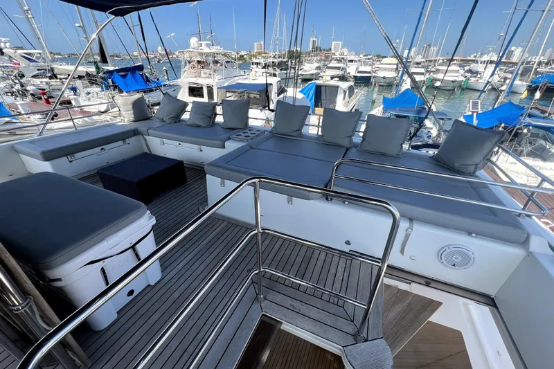 Capricho Yacht Photos Pics Luxurious 2011 Lagoon 560 yacht deck with cushioned seating and marina view.