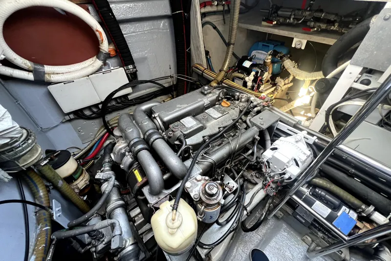 Capricho Yacht Photos Pics Engine room of a 2011 Lagoon 560 yacht, showcasing mechanical components and wiring.