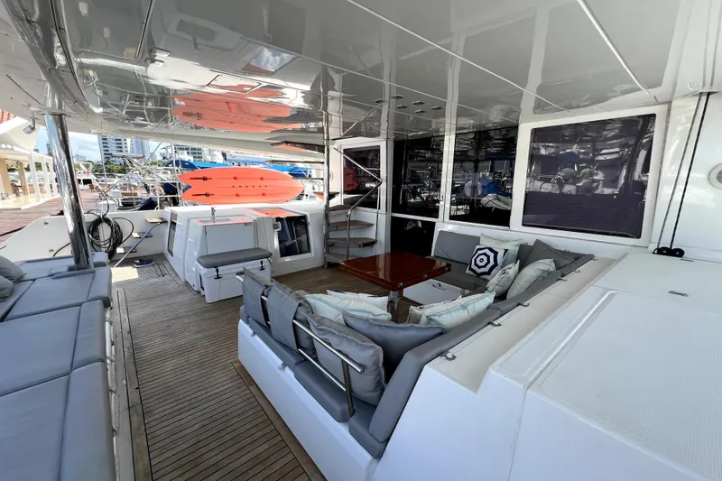Capricho Yacht Photos Pics Spacious deck of 2011 Lagoon 560 yacht with seating and paddleboards.