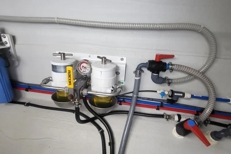  Yacht Photos Pics Engine room of 2024 Fountaine Pajot MY6 with fuel filtration system and plumbing.