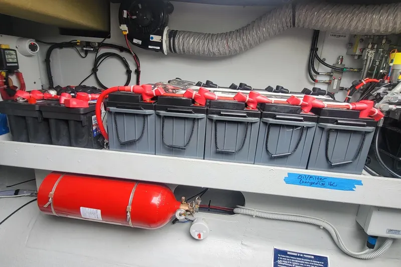  Yacht Photos Pics Battery compartment of 2024 Fountaine Pajot MY6 with fire extinguisher and wiring.