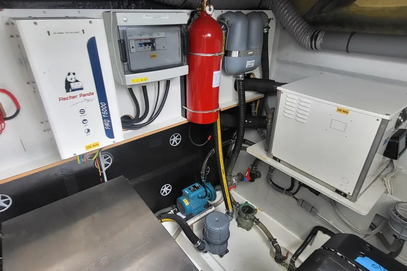  Yacht Photos Pics Engine room of 2024 Fountaine Pajot MY6 with Fischer Panda generator and fire extinguisher.
