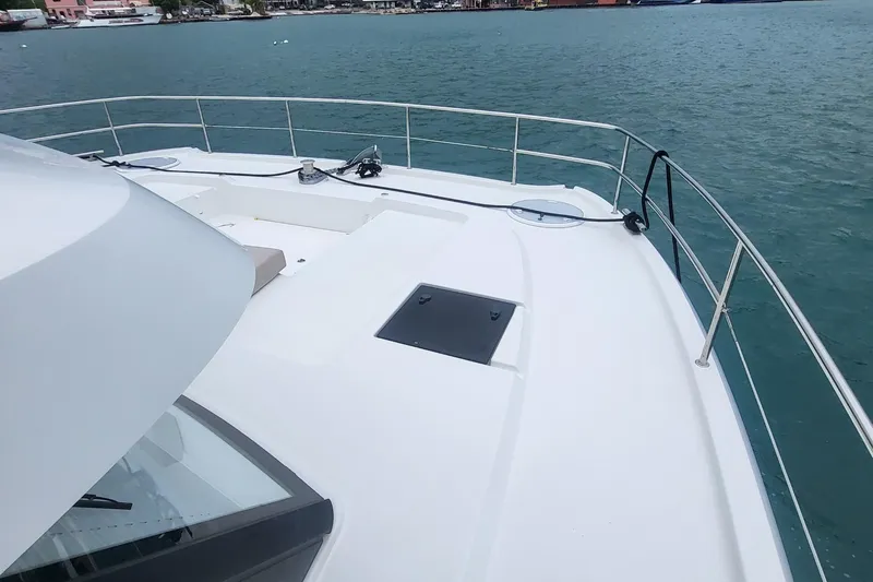 Yacht Photos Pics 2024 Fountaine Pajot MY6 yacht deck overlooking calm blue waters.