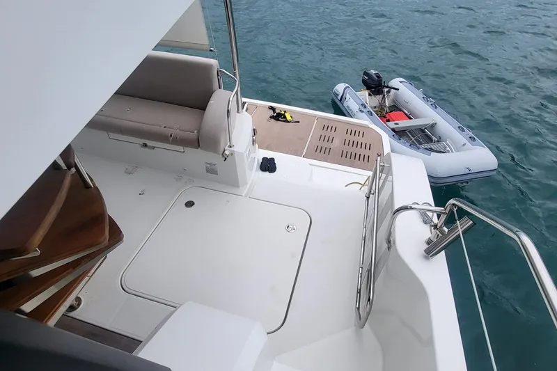  Yacht Photos Pics 2024 Fountaine Pajot MY6 yacht deck with inflatable boat on water.