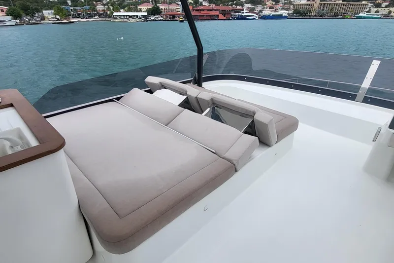  Yacht Photos Pics 2024 Fountaine Pajot MY6 yacht with spacious deck and comfortable seating by the water.