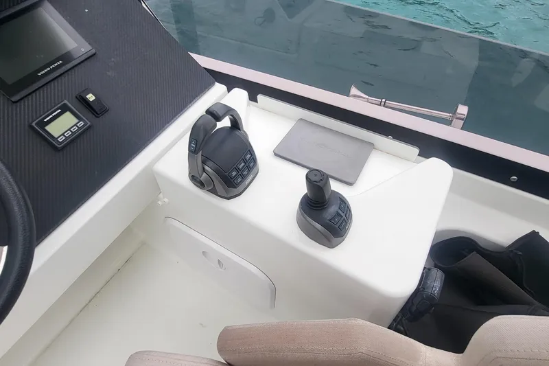 Yacht Photos Pics Control panel of 2024 Fountaine Pajot MY6 yacht with joystick and throttle controls.