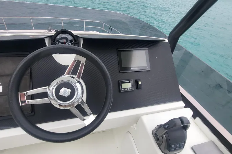  Yacht Photos Pics 2024 Fountaine Pajot MY6 helm with steering wheel and navigation controls.