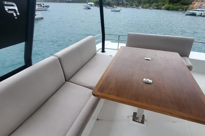  Yacht Photos Pics Luxurious seating area on 2024 Fountaine Pajot MY6 yacht with ocean view.