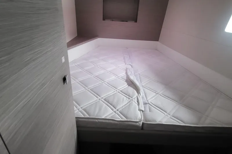  Yacht Photos Pics 2024 Fountaine Pajot MY6 cabin with a spacious, neatly arranged bed.