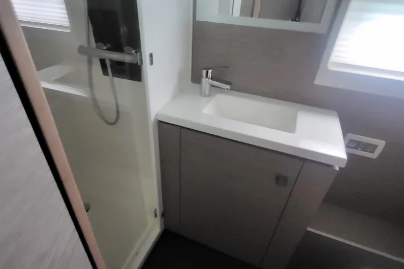  Yacht Photos Pics 2024 Fountaine Pajot MY6 bathroom with modern sink and shower.