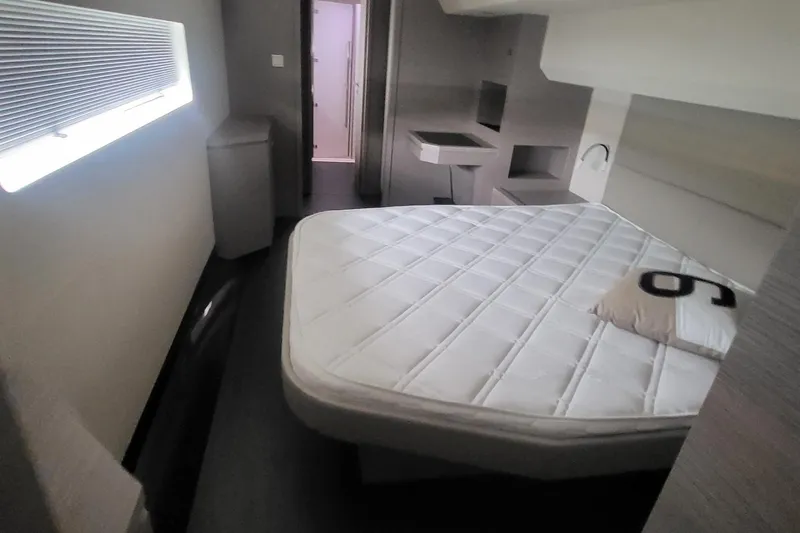  Yacht Photos Pics 2024 Fountaine Pajot MY6 yacht cabin with modern interior and comfortable bed.