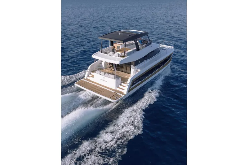  Yacht Photos Pics 2024 Fountaine Pajot MY6 yacht cruising on open sea, showcasing sleek design and luxury.