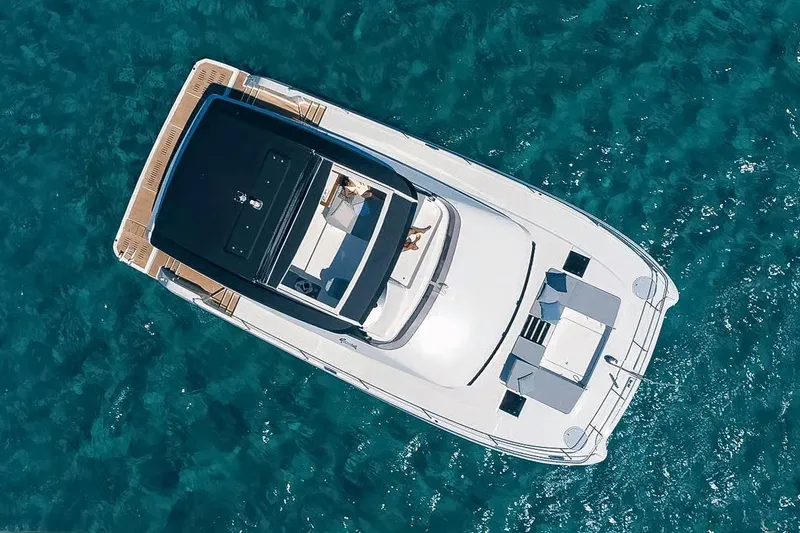  Yacht Photos Pics Aerial view of 2024 Fountaine Pajot MY6 yacht on clear blue water.