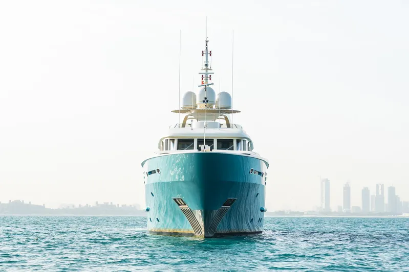 Aquamarina Yacht Photos Pics Front view of a 2007 ISA Isa 470 yacht on calm waters with city skyline.