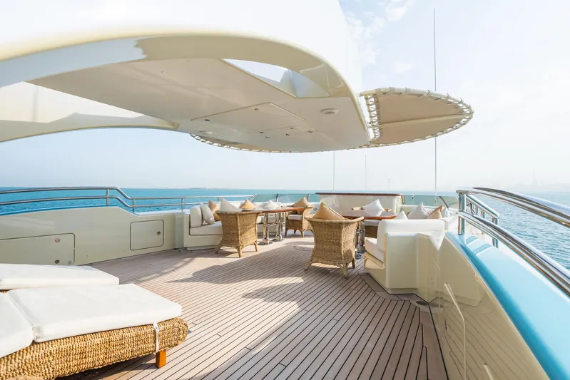 Aquamarina Yacht Photos Pics Luxurious deck of 2007 ISA Isa 470 yacht with wicker furniture and ocean view.