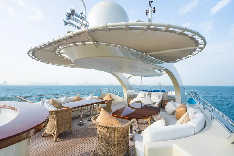 Aquamarina Yacht Photos Pics Luxurious 2007 ISA Isa 470 yacht deck with elegant seating and ocean view.