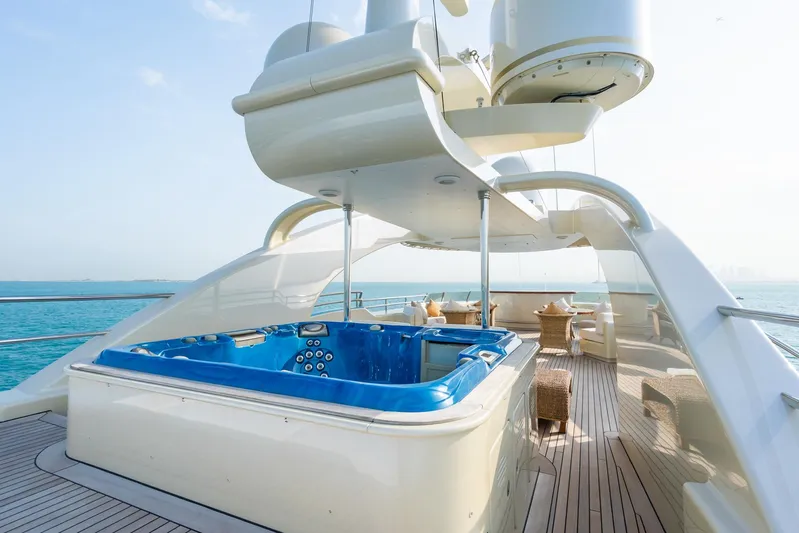 Aquamarina Yacht Photos Pics Luxury yacht deck with hot tub, ISA 470 model, 2007, overlooking serene ocean waters.