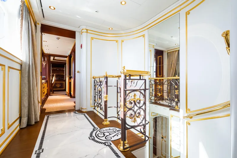 Aquamarina Yacht Photos Pics Luxurious interior of 2007 ISA Isa 470 yacht with elegant gold accents and ornate railings.