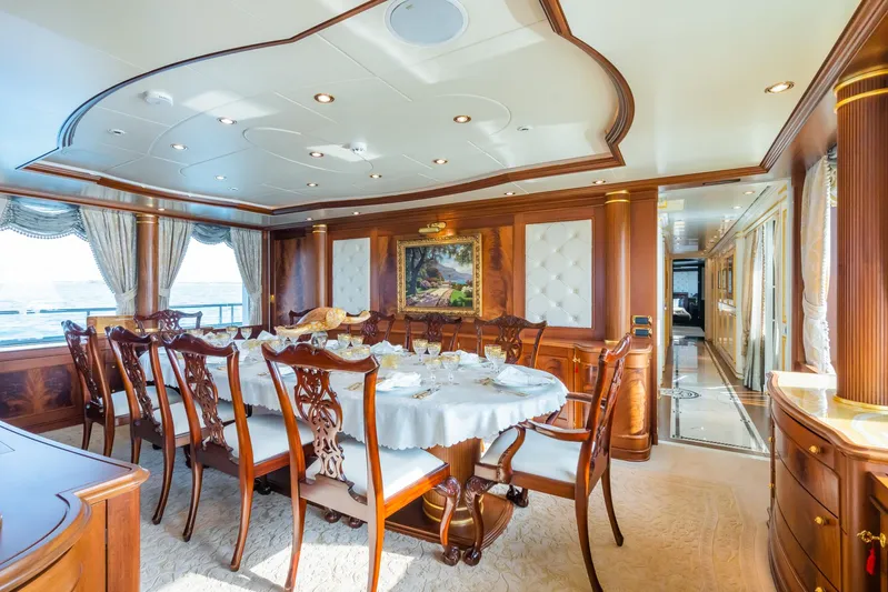 Aquamarina Yacht Photos Pics Luxurious dining room on 2007 ISA Isa 470 yacht with elegant wood furnishings.