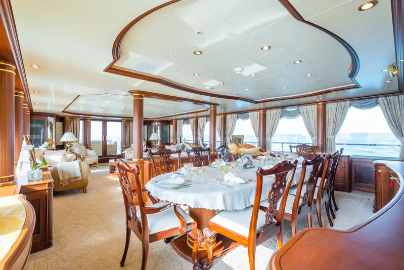 Aquamarina Yacht Photos Pics Luxurious dining area on 2007 ISA Isa 470 yacht with elegant wooden furnishings and ocean view.