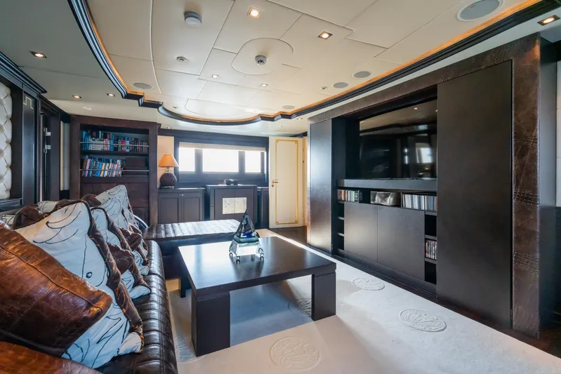 Aquamarina Yacht Photos Pics Luxurious interior of 2007 ISA Isa 470 yacht with modern entertainment area and plush seating.