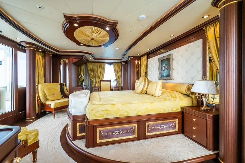 Aquamarina Yacht Photos Pics Luxurious bedroom interior on 2007 ISA Isa 470 yacht, featuring elegant gold and wood accents.