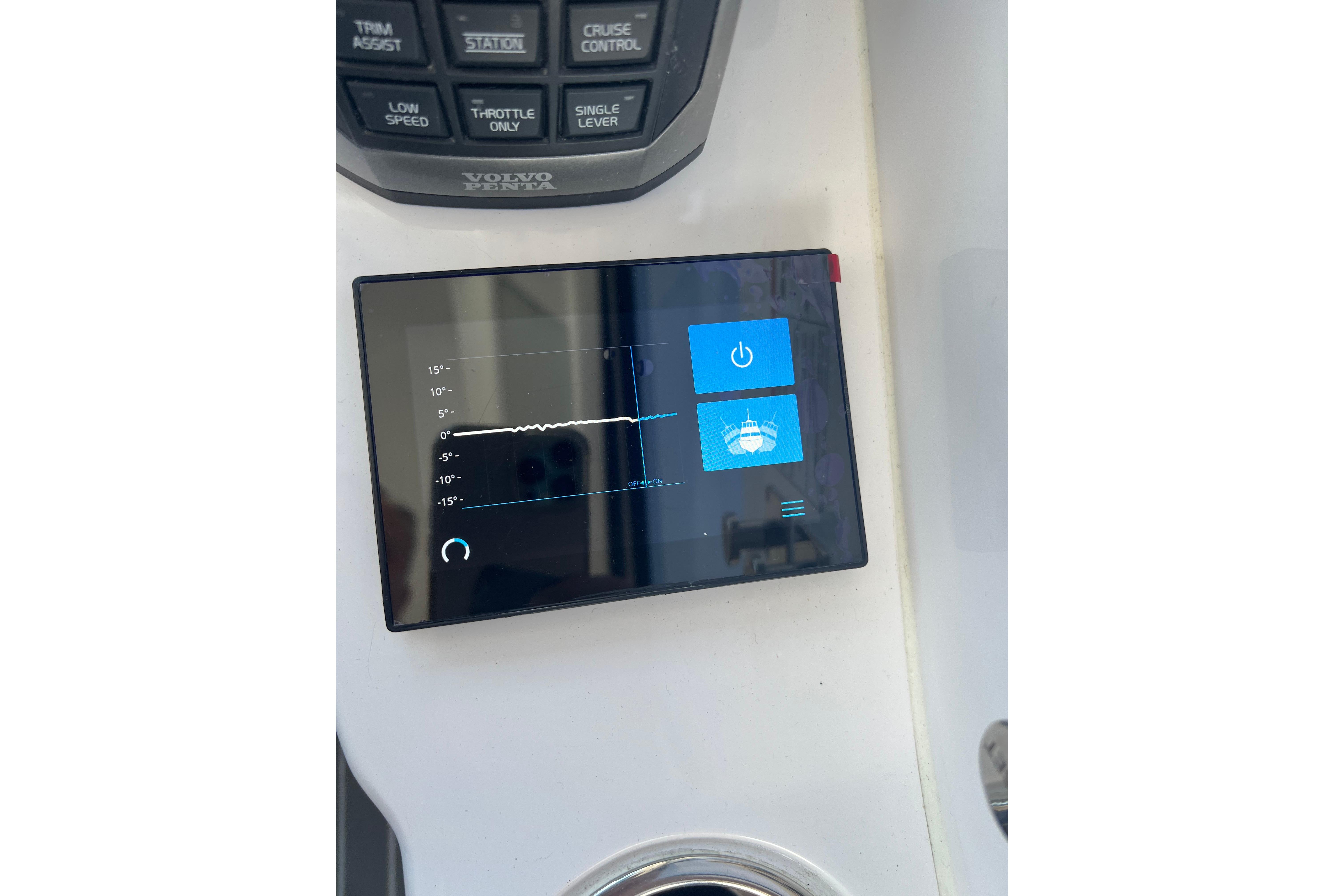 Control panel of a 2021 Evolve 400HT boat with digital display and buttons.