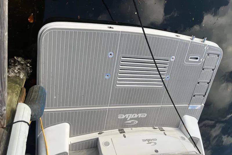 Romaniac Yacht Photos Pics 2021 Evolve 400HT boat stern with sleek gray deck and logo.